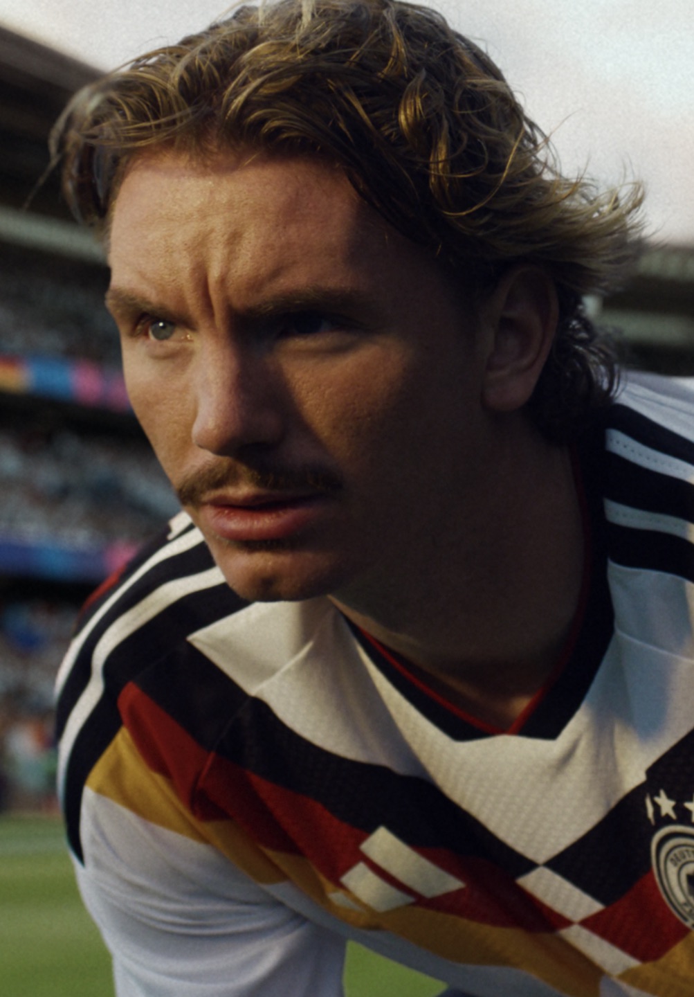 Player in a retro Germany kit, portrait crop from the DOOH run